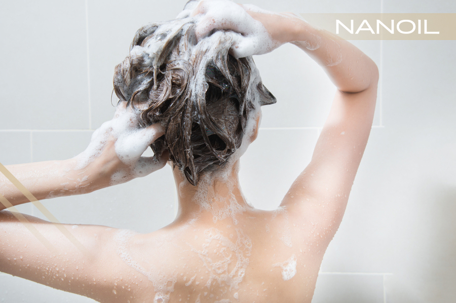 Woman in the shower washing her hair